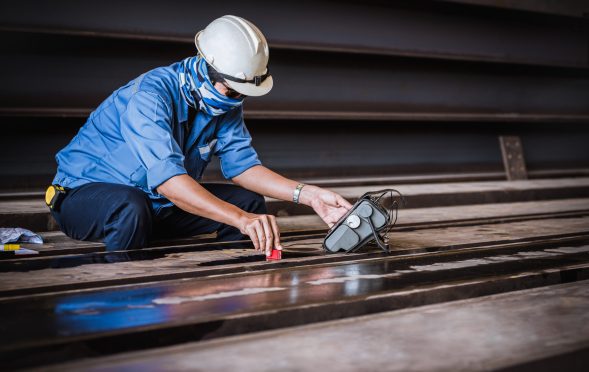 UT, Ultrasonic testing to detect imperfection or defect in welding of steel structure outside. NDT Inspection.